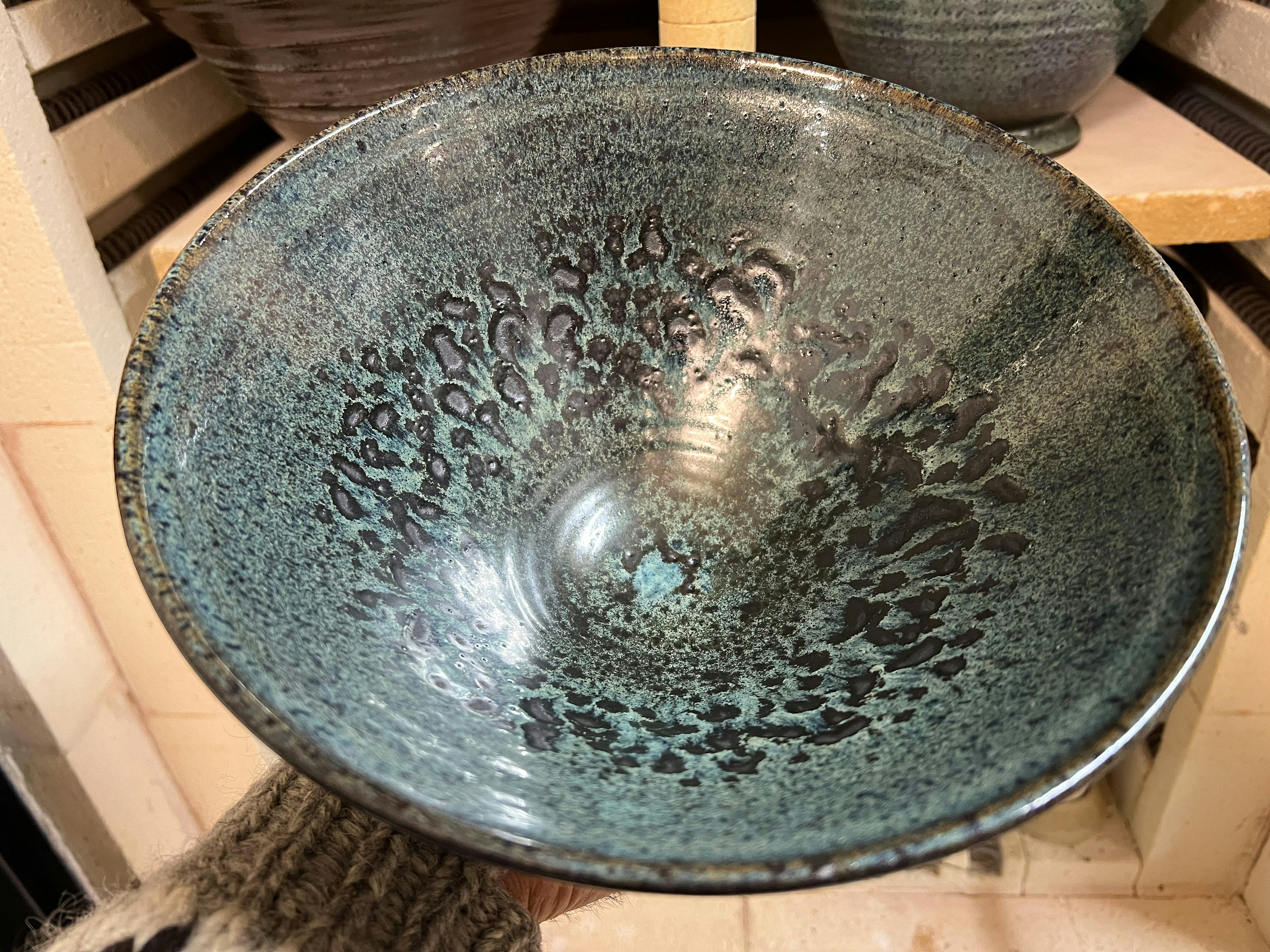 Stonware. The glaze magic happens during firing (1260-80 degrees in Celcius).