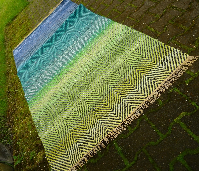 "Spring." Floor or wall rug.  Binding: slanting ribbed weft. Material: Up-cycled cloth. L 204 cm. B 94 m. 